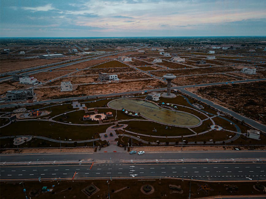 Financial analyst working on multiple monitors